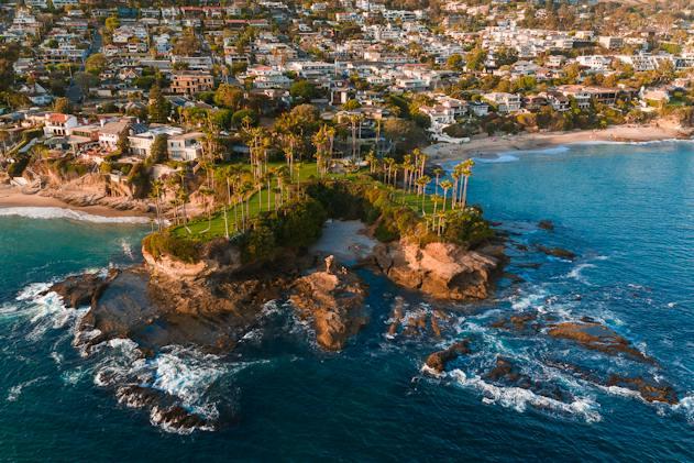 the California coast line, full of palm trees and luxury homes